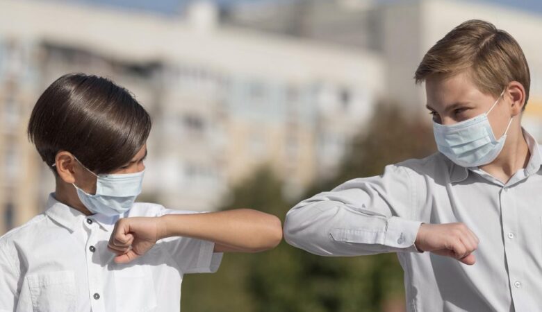 front-view-kids-greeting-with-elbow-bump