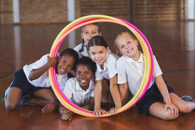 school-kids-looking-through-hula-hoop-basketball-court_